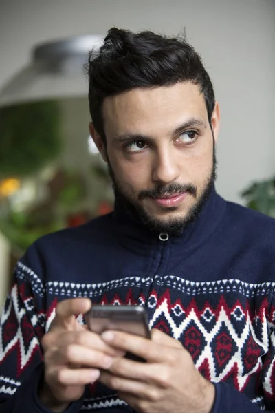 Portrait of handsome man with phone in his hand — Stock Photo, Image