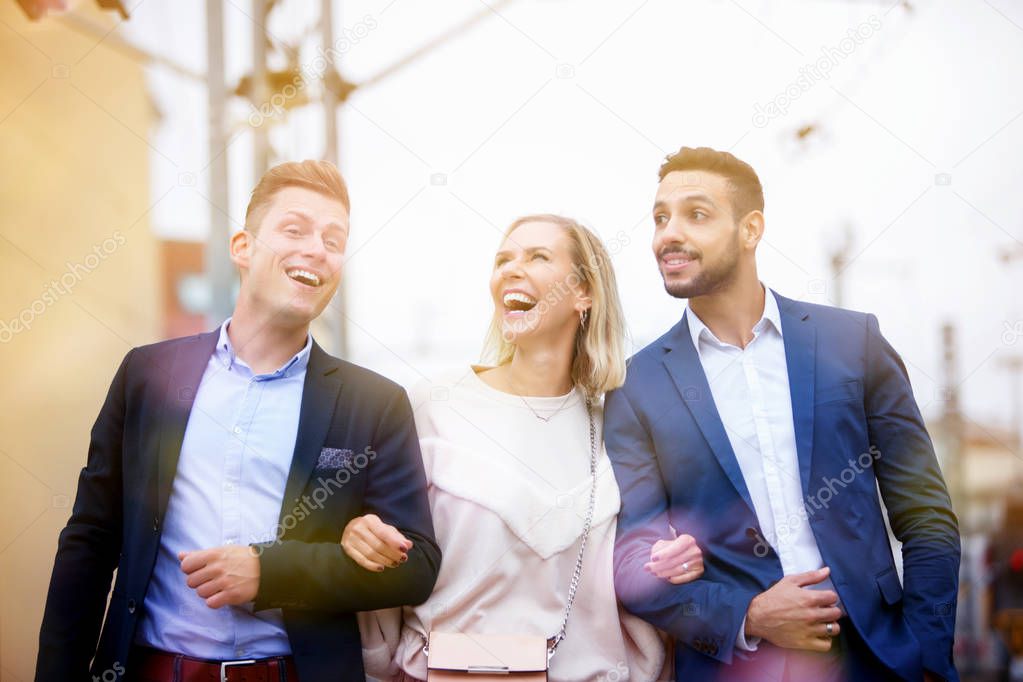 group of friends walking and laughing