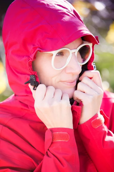 Portrait of beautiful woman in red coat — Stock Photo, Image