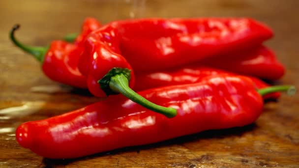 Cinemagraph Red Chilies Table Water Verter — Vídeo de stock