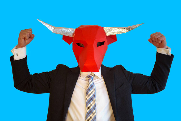 businessman with bull mask flexing his muscles