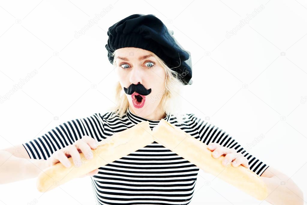 woman dressed as a french man with beard and beret and baguette