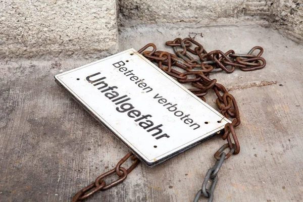 Sign with german words No trespassing Accident hazard — Stock Photo, Image