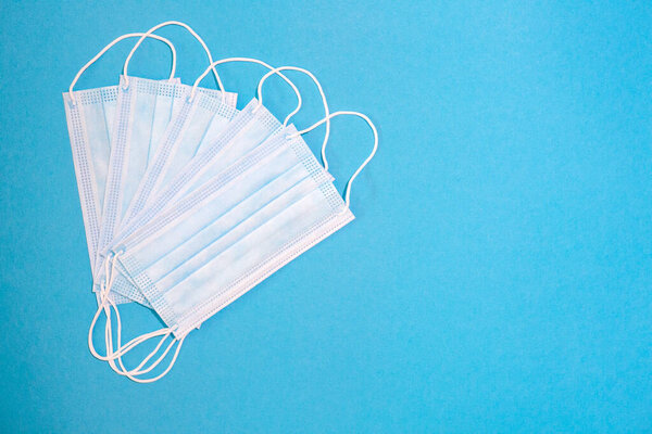 close-up of facemasks on blue background
