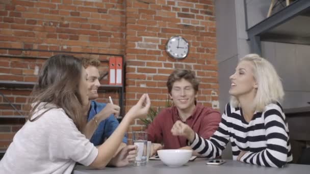 Group of cheerful young people discussing project. — Stock Video