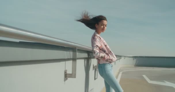 Young beautiful woman enjoying time on a rooftop parking. — Stock Video