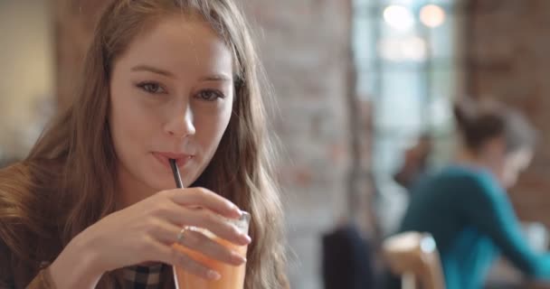 Close Portrait Young Beautiful Woman Drinking Orange Juice Cozy Restaurant — Stock Video