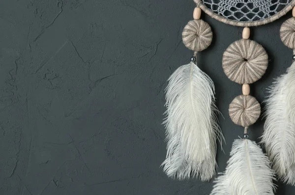 Gray white dream catcher on dark gray