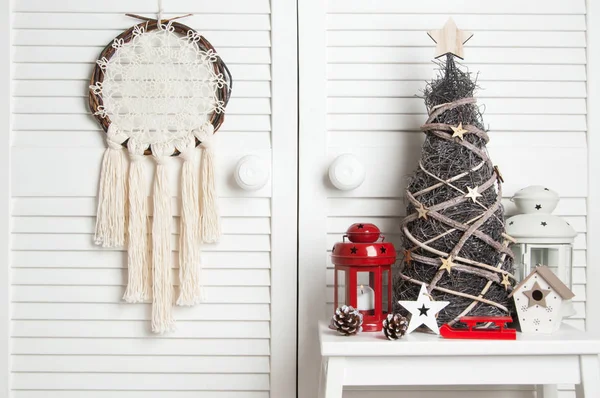 Christmas dream catcher on door background