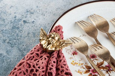 Old bronze forks on concrete 