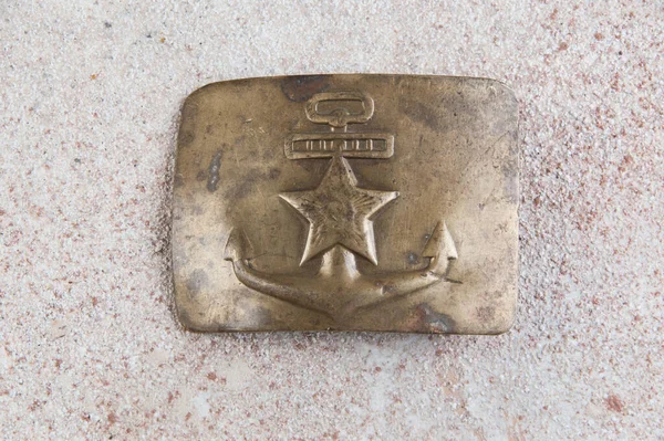 Old brass belt buckle with a star — Stock Photo, Image