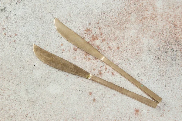 Two Old Bronze Knives Concrete Background Copy Space Text Food — Stock Photo, Image