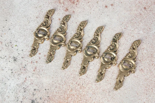 Six Antique Brass Keyholes Lock Covers Concrete Background Copy Space — Stock Photo, Image