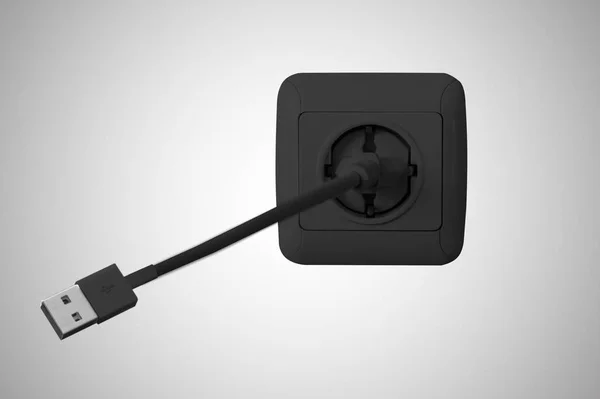 Tomada elétrica preta na parede e cabo USB — Fotografia de Stock