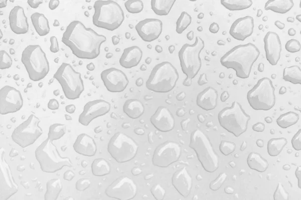 Gouttes d'eau sur une surface blanche — Photo
