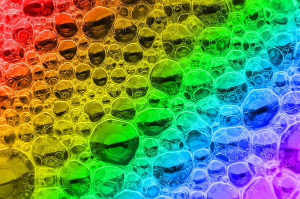 Vícebarevný vzor bublin jako pěnová struktura na tekutém příboji — Stock fotografie