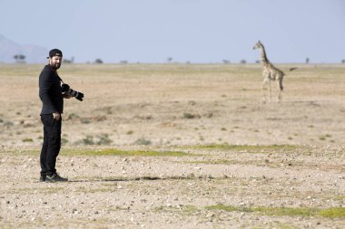 alone photographer in desert clipart
