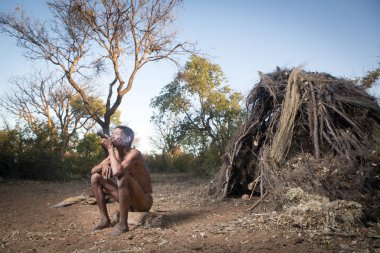siting Himba man clipart