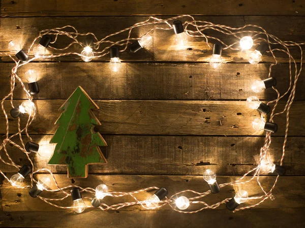 Різдвяна ялинка на фоні дерева Стокове Зображення
