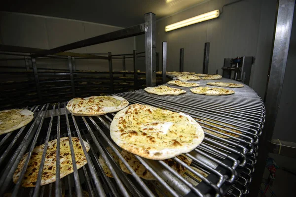 Piadina running on conveyor belt