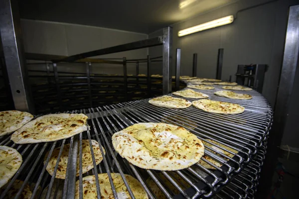 Piadina running on conveyor belt