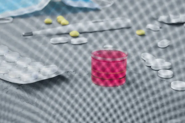 medicines on the table, look through the mesh of the trash can