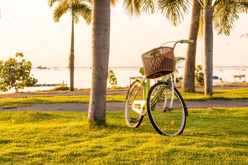 bicycle in beach with sunset