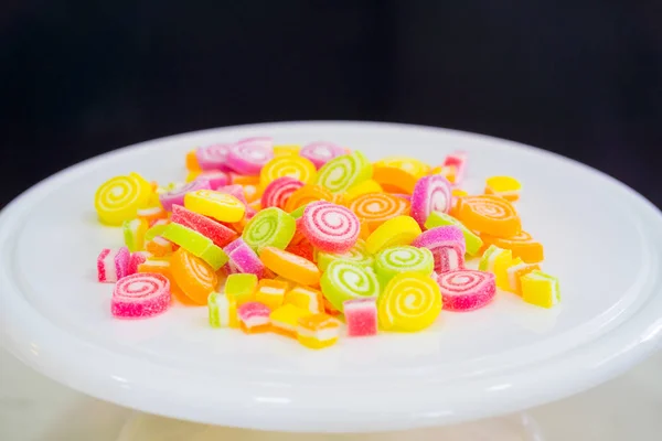 Colorful sweet jelly candies on white plate — Stock Photo, Image