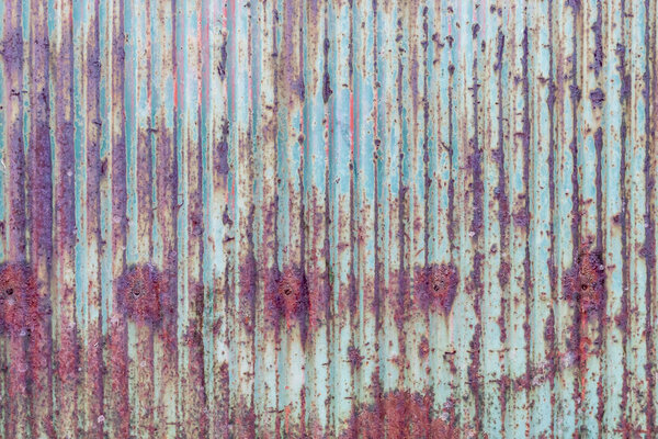 Old Weathered Rusty Vertically Striped Metal Fence