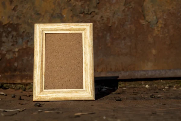 Empty Picture Frame on Vintage Rusty Metal Shelf