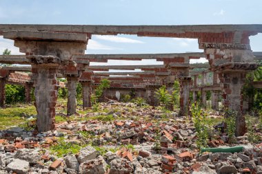 Construction Columns and Beams in Heavily Damaged and Ruined Abandoned Building