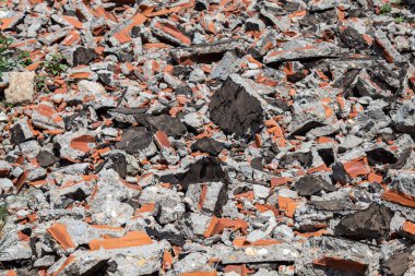 Broken Red Bricks and Pieces of Concrete of Ruined Building on The Ground