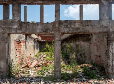 Construction Columns and Beams in Heavily Damaged and Ruined Abandoned Building