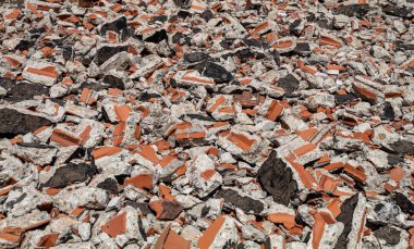 Broken Red Bricks and Pieces of Concrete of Ruined Building on The Ground