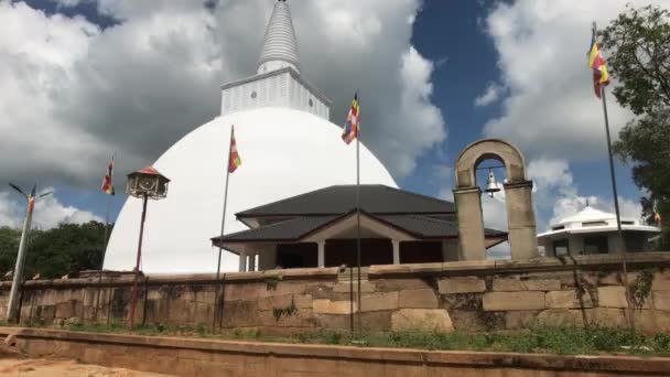 Anuradhapura, Sri Lanka, the view through the flags on a small Dagoba — Stock Video