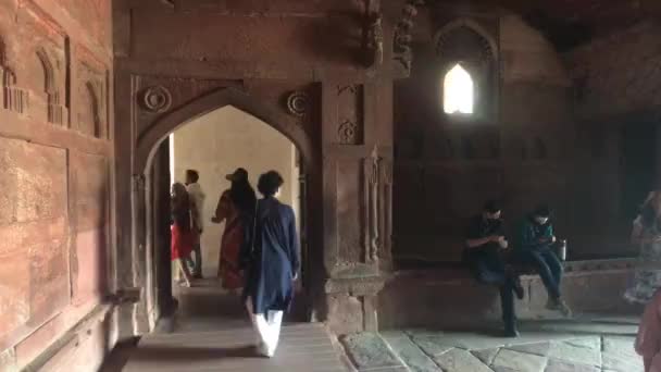 Agra, India, November 10, 2019, Agra Fort, tourists walk along the red brick structure part 7 — ストック動画