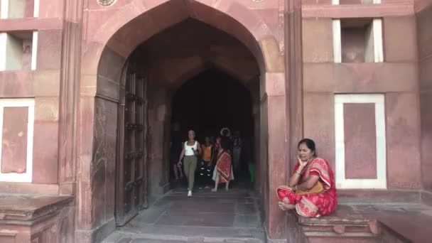 Agra, India, November 10, 2019, Agra Fort, tourists walk along the red brick structure part 9 — ストック動画