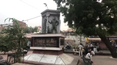 Jaipur, India - November 03, 2019: Tourists sit under a tree