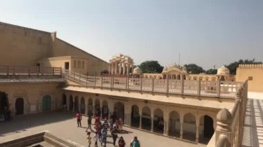 Jaipur, India - November 04, 2019: Hawa Mahal tourists walk in the square near the fountain part 2