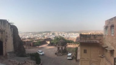 Jodhpur, India - moving cars at the foot of the fortress