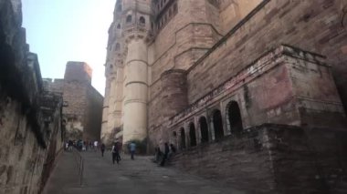 Jodhpur, India - November 06, 2019: Mehrangarh Fort Tourist climbs on steep road part 2