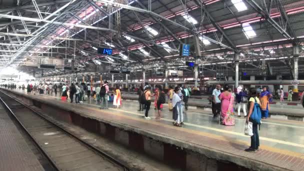 Mumbai, India - November 10, 2019: Chhatrapati Shivaji Terminus tourists move around the railway station — 图库视频影像