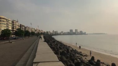Mumbai, India - November 10, 2019: Marine Drive tourists on the waterfront in Bombay is located in the Bay of Beck Bey in the Arabian Sea part 4