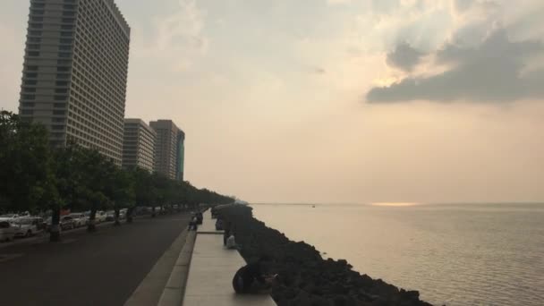 Mumbai, India - November 10, 2019: Marine Drive tourists walk along the embankment part 8 — Stock Video