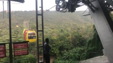 Udaipur, India - November 12, 2019: Mansapurna Karni Mata Ropeway tourists ride in a cable car part 6