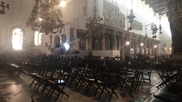 Bethlehem, Palestine - October 20, 2019: Basilica of the Nativity tourists inspect the interior part 5 — Stock Video