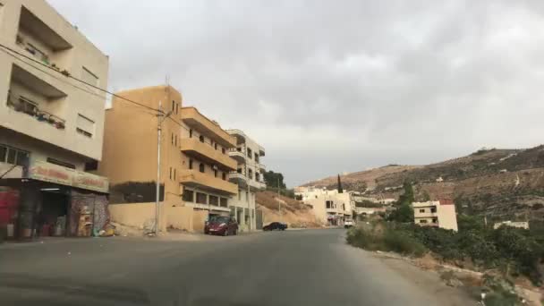 Амман, Иордания - Вид из окна автомобиля на городские улицы часть 4 — стоковое видео
