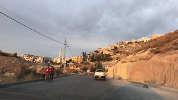 Amman, Jordan - View from the car window to the city streets part 5 — ストック動画