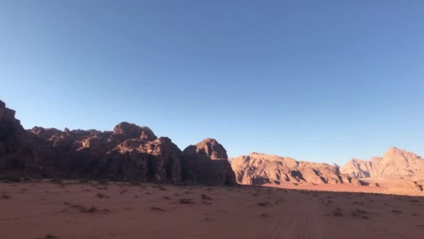 Wadi Rum, Jordan - red sand in the desert against the backdrop of rocky mountains part 3 — Stock Video