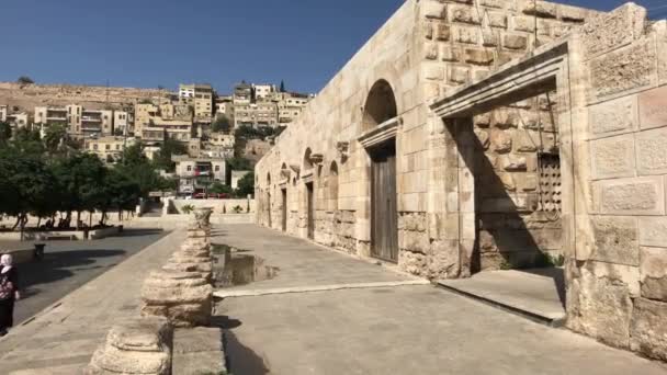 Amman, Jordan - October 20, 2019: Roman Amphitheater tourists walk through the ruins part 17 — Stock Video